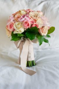 Wedding bouquet of pink and cream roses